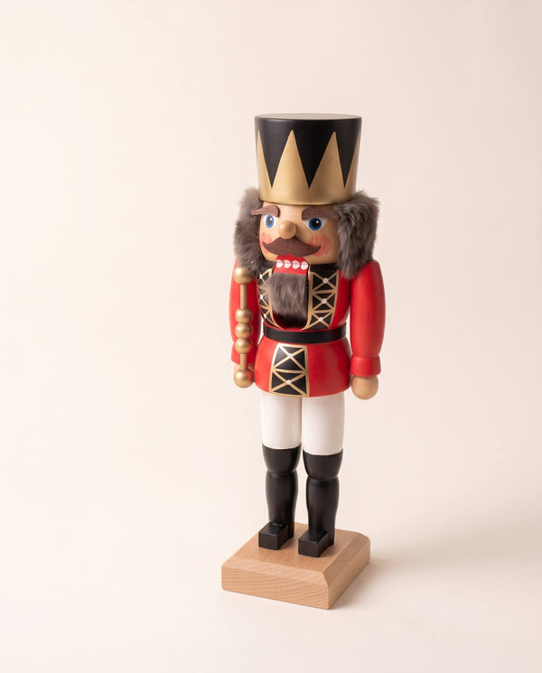 Red and gold hand-painted wooden nutcracker king with a crown, made in Seiffen, Germany