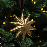 Gold Sunburst Ornament — Handcrafted Metal with Velvet Ribbon