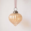 2 inch champagne gold ribbed glass lantern ornament with a bronze cap and ribbon hanger, made in India