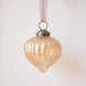 2 inch champagne gold ribbed glass lantern ornament with a bronze cap and ribbon hanger, made in India