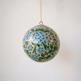 2 inch turquoise-green papier-mache ornament hand-painted with a Kashmiri floral motif