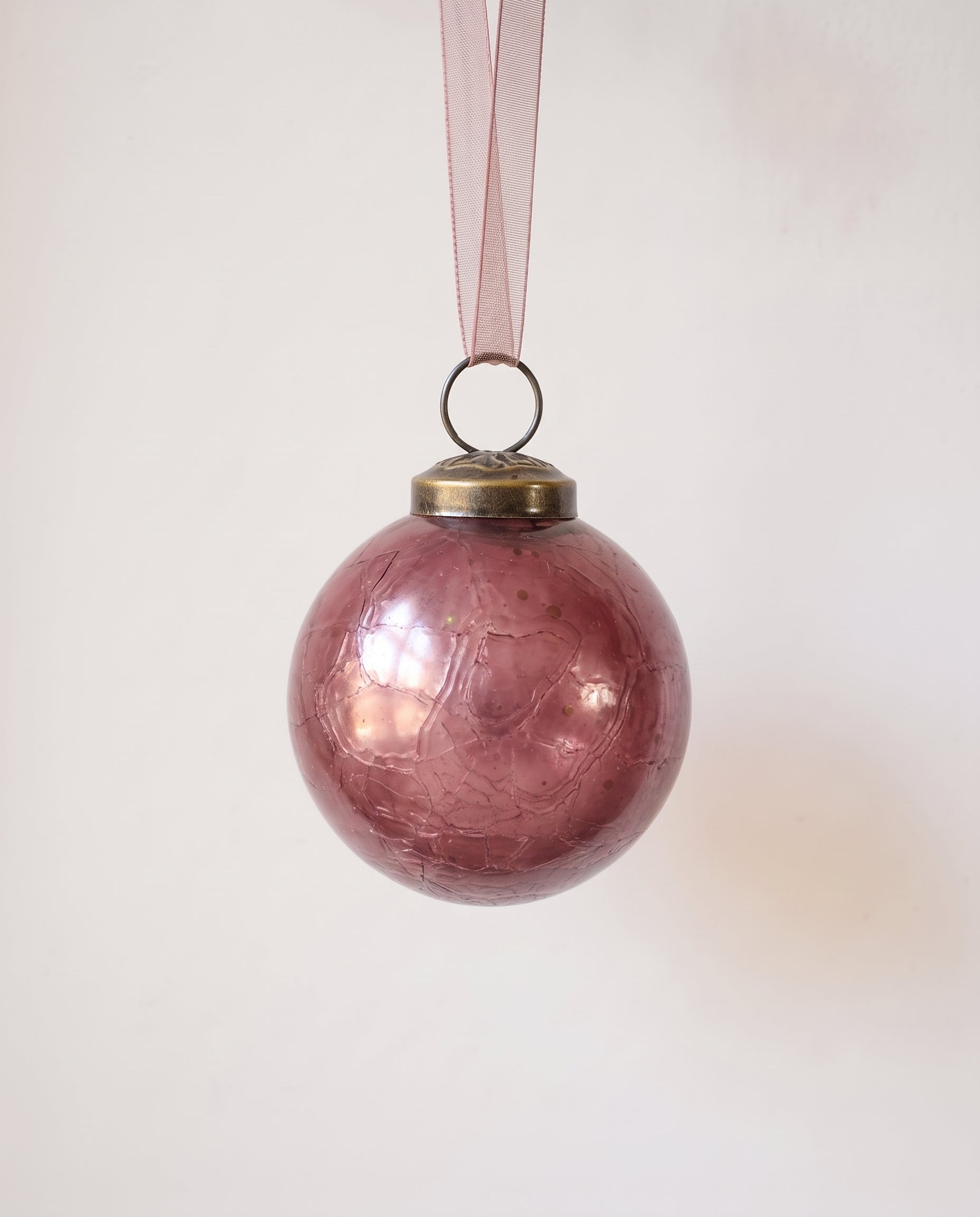 2 inch mauve crackle glass Christmas bauble with a bronze cap and ribbon hanger, made in India
