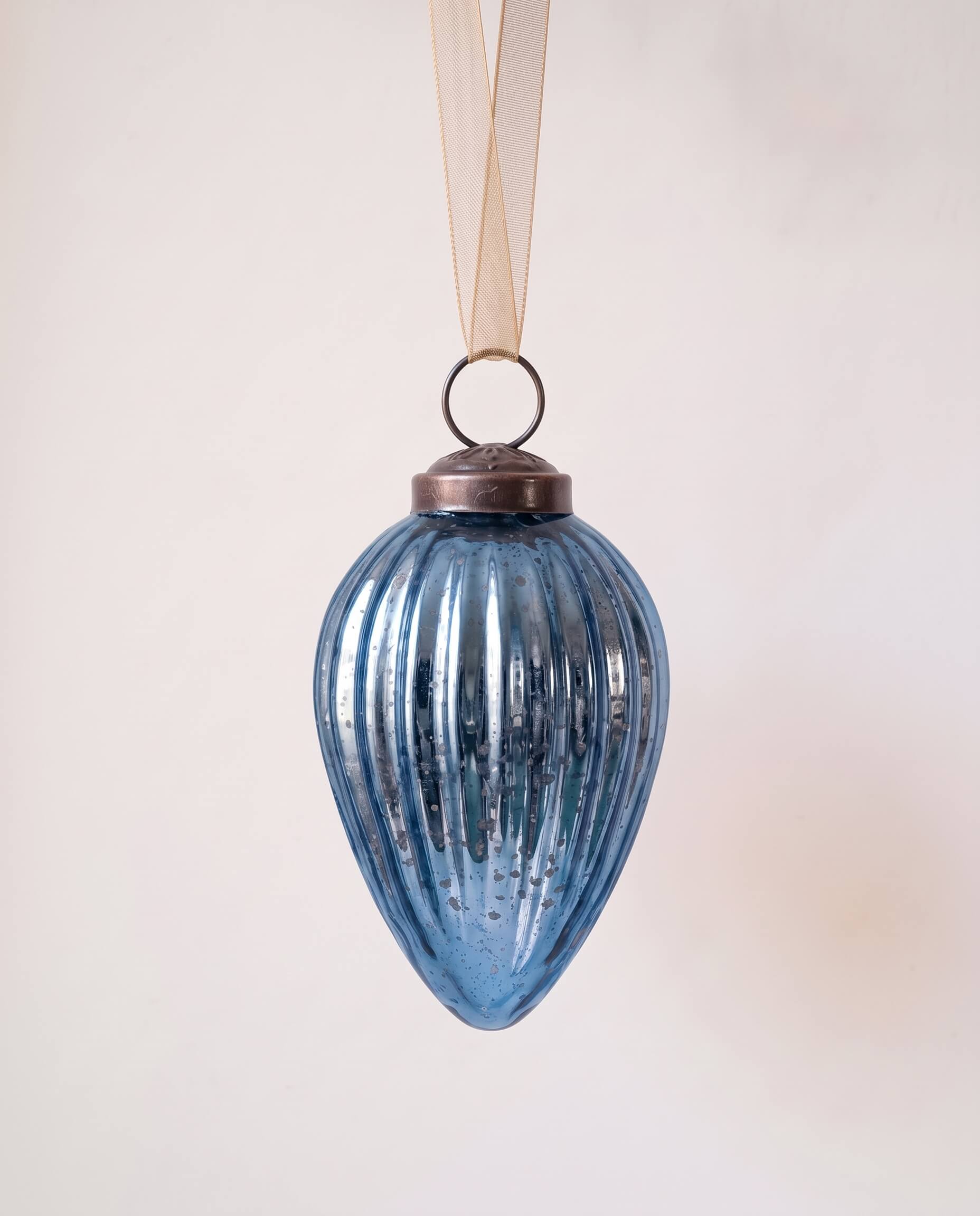 2 inch deep navy pressed glass pinecone ornament with a bronze cap and ribbon hanger, made in India