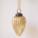 3 inch gold pressed glass pinecone ornament with a bronze cap and ribbon hanger, made in India