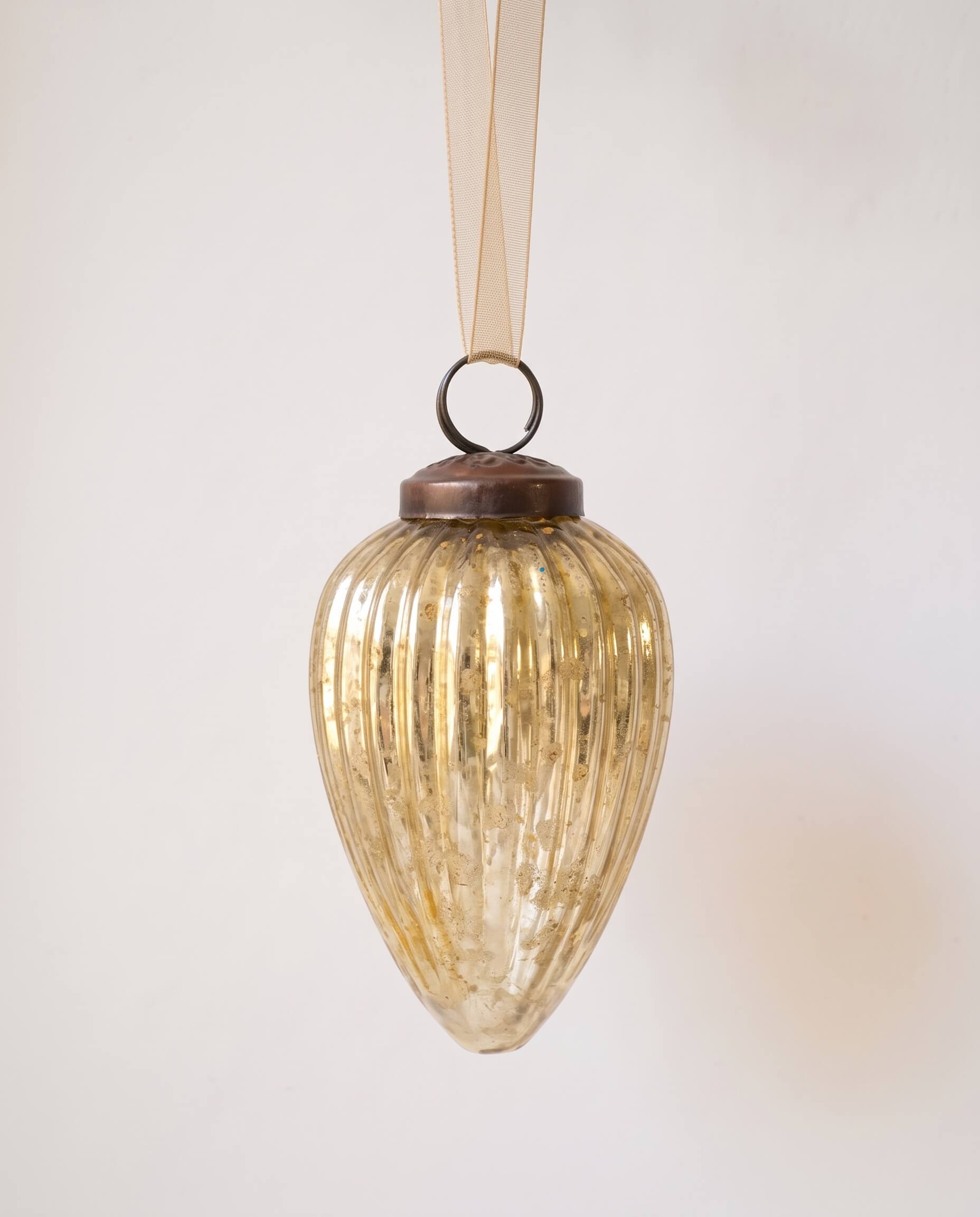 3 inch gold pressed glass pinecone ornament with a bronze cap and ribbon hanger, made in India