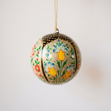 3 inch papier-mache Christmas ornament hand-painted with a multicoloured Kashmiri floral motif