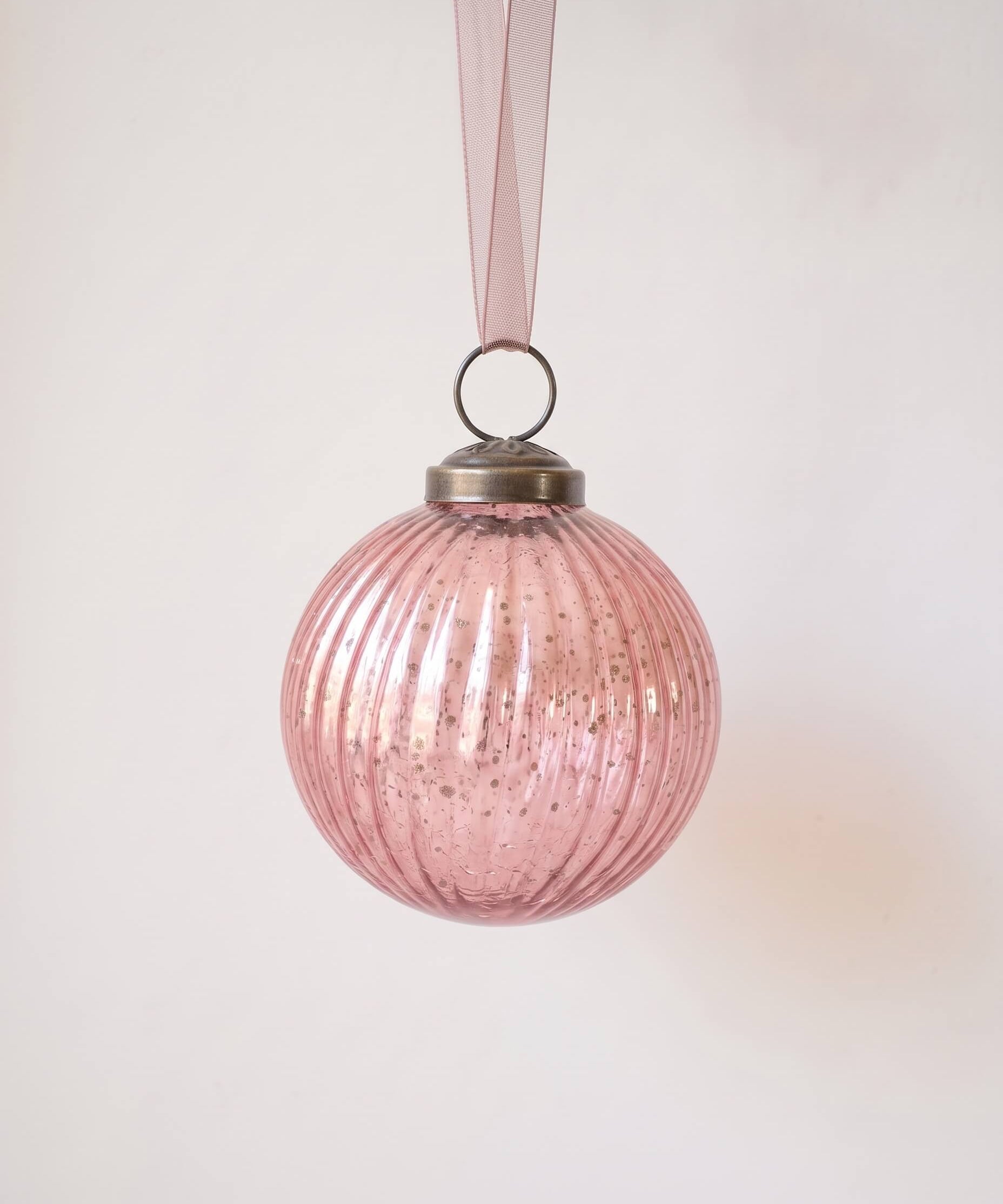 3 inch mauve ribbed glass Christmas bauble with a bronze cap and ribbon hanger, made in India