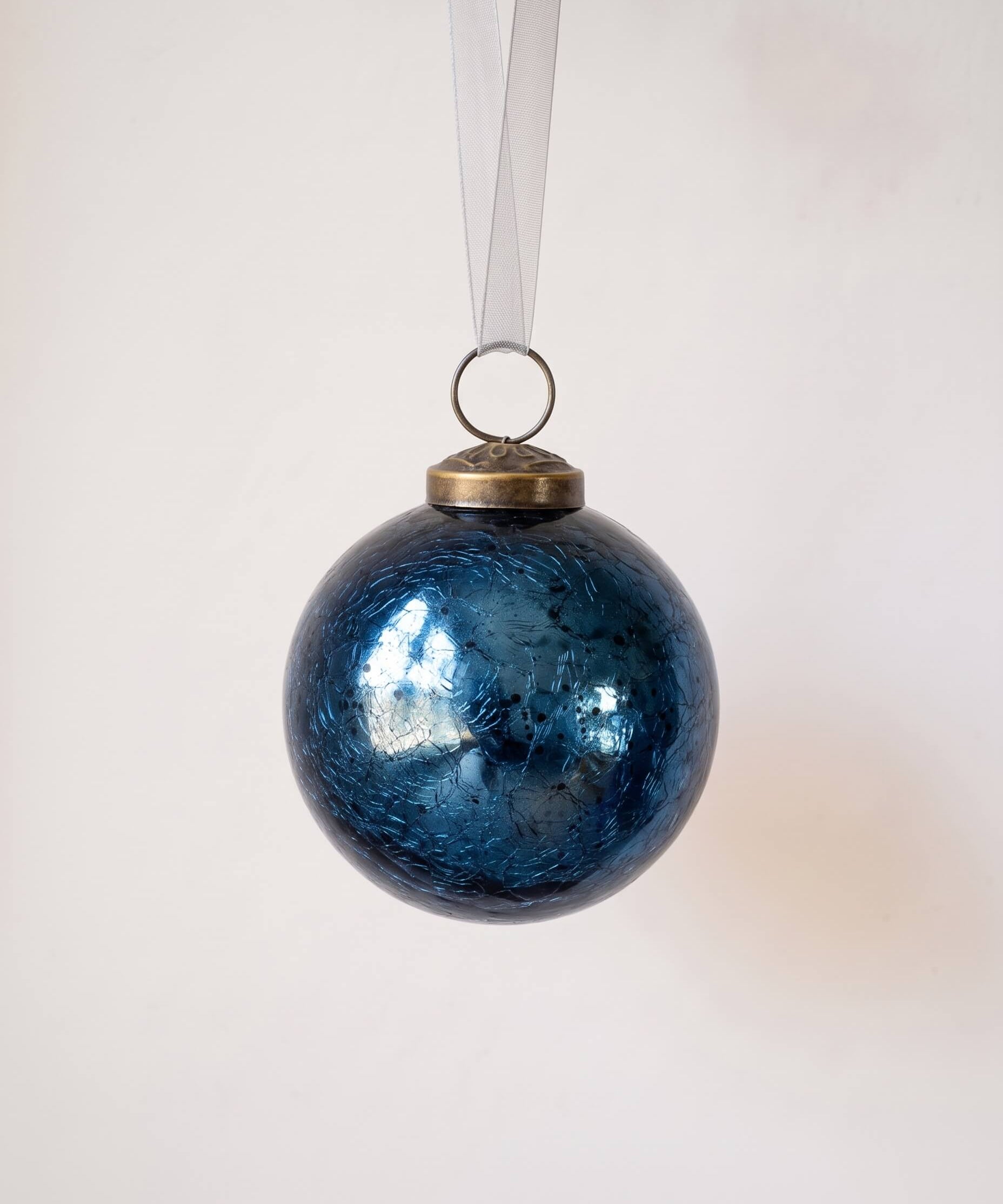 3 inch deep navy crackle glass Christmas bauble with a bronze cap and ribbon hanger, made in India