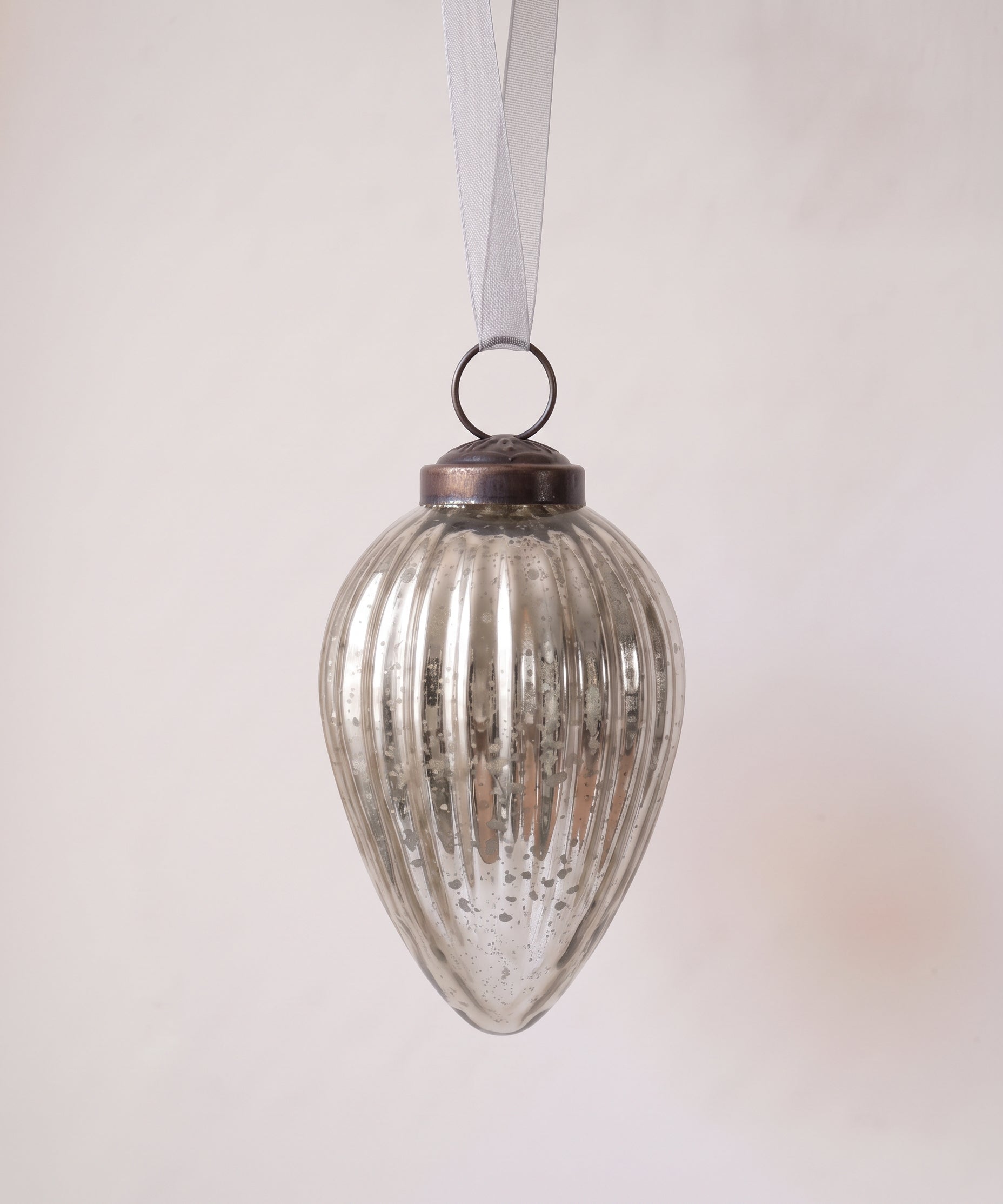 3 inch silver pressed glass pinecone ornament with a bronze cap and ribbon hanger, made in India