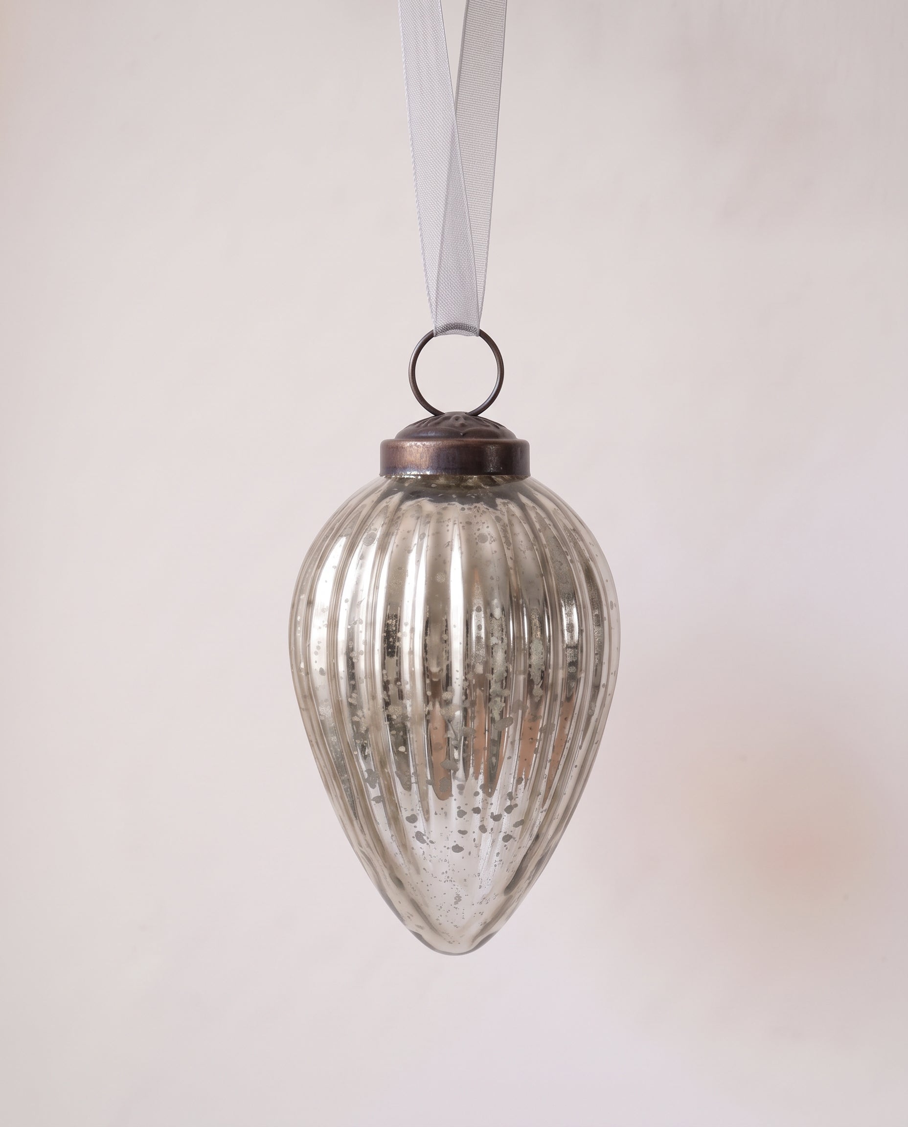 3 inch silver pressed glass pinecone ornament with a bronze cap and ribbon hanger, made in India