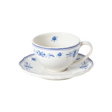Blue and white floral teacup with matching scalloped saucer