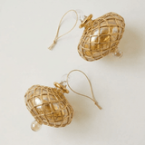 Hand-blown amber glass saucer ornament painted with a gold diamond harlequin pattern, made in Old Cairo, Egypt