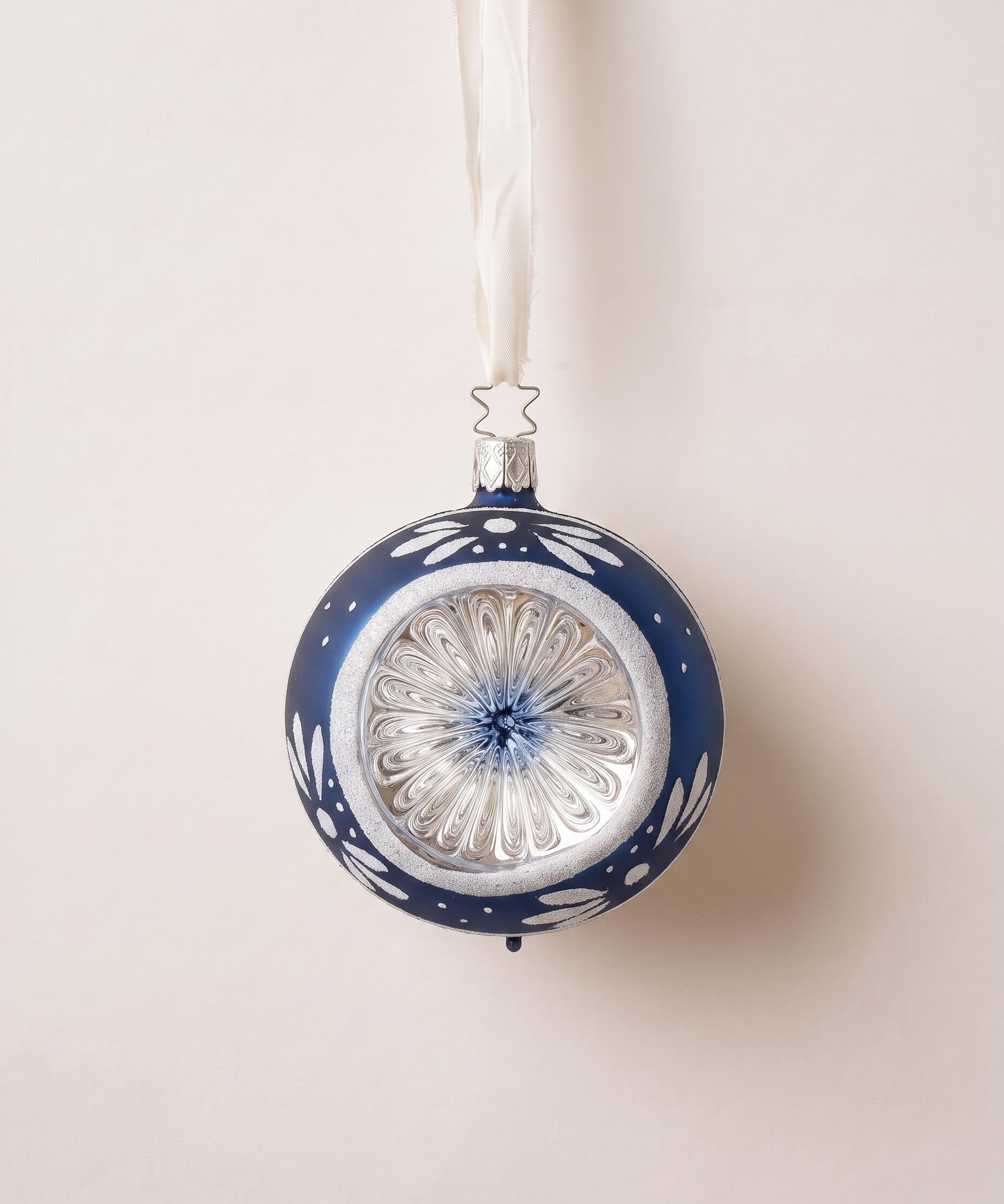 Midnight blue glass reflector ornament with hand-painted blossoms, mouth-blown by Inge-Glas of Lauscha, Germany