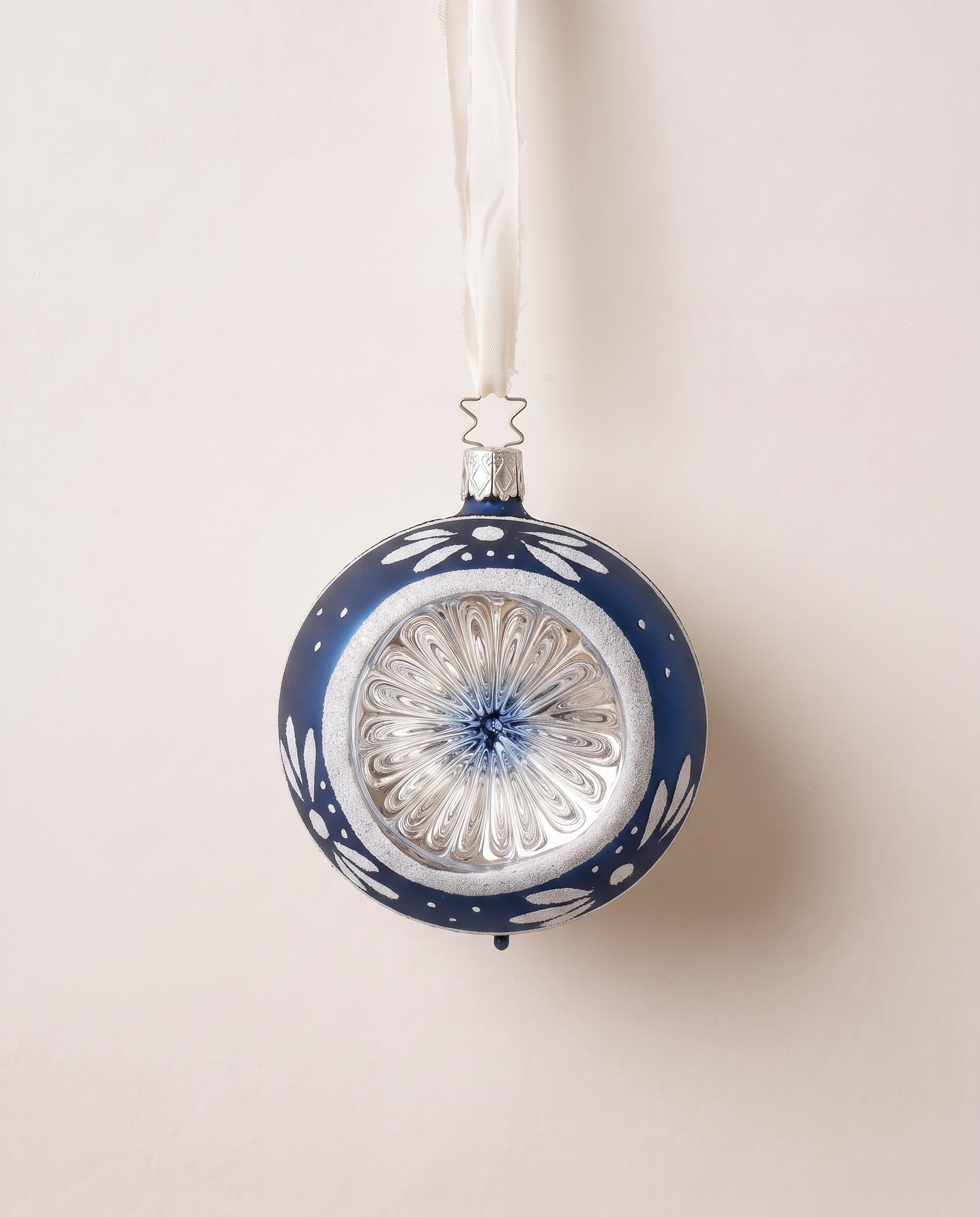 Midnight blue glass reflector ornament with hand-painted blossoms, mouth-blown by Inge-Glas of Lauscha, Germany
