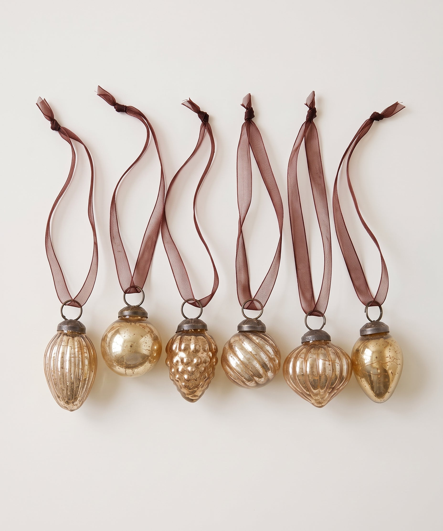 Set of six champagne gold crackle glass Christmas baubles with bronze caps and ribbon hangers, made in India