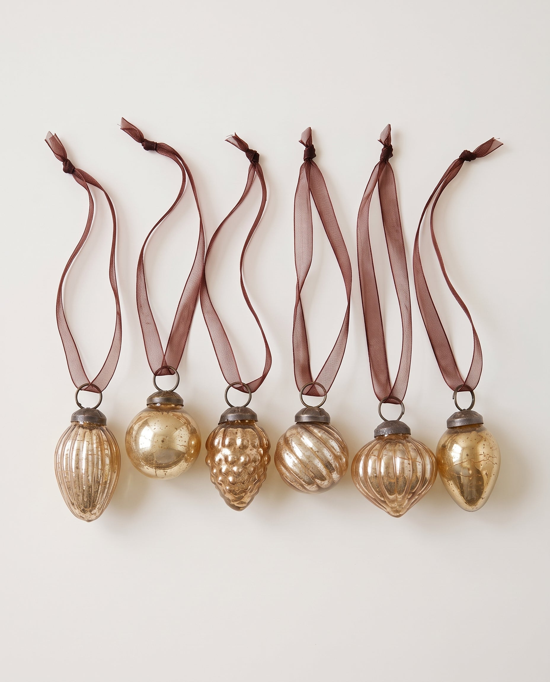 Set of six champagne gold crackle glass Christmas baubles with bronze caps and ribbon hangers, made in India