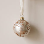 Matte champagne mouth-blown glass ornament with glittered swirls, by Inge-Glas of Lauscha, Germany