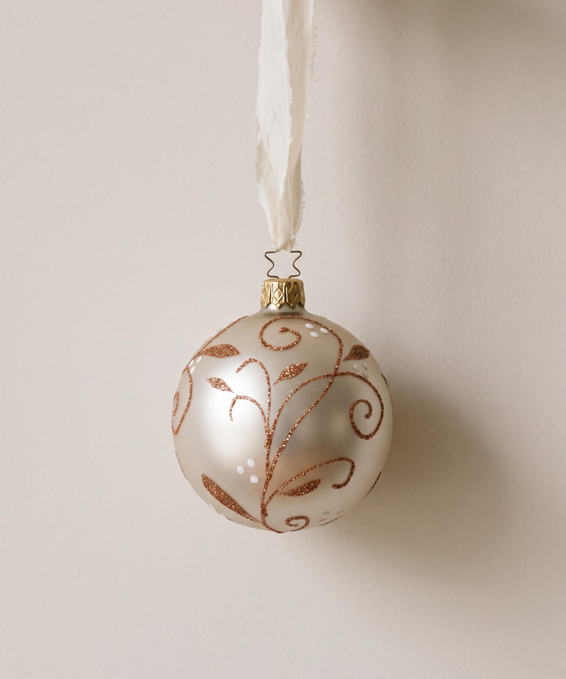 Matte champagne mouth-blown glass ornament with glittered swirls, by Inge-Glas of Lauscha, Germany