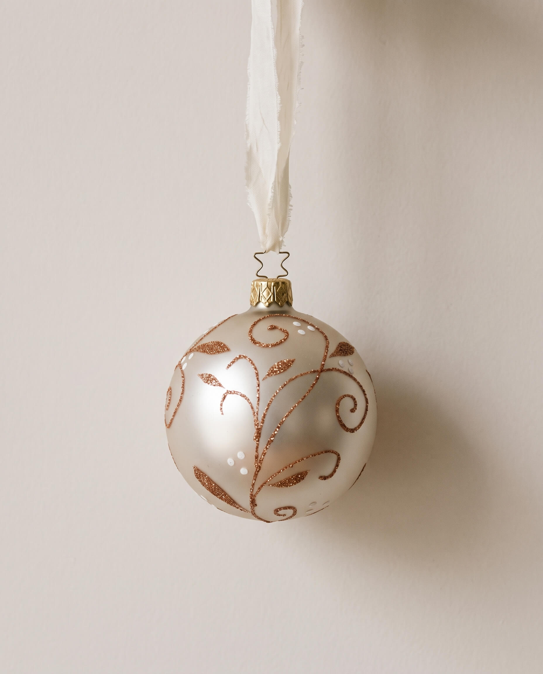 Matte champagne mouth-blown glass ornament with glittered swirls, by Inge-Glas of Lauscha, Germany