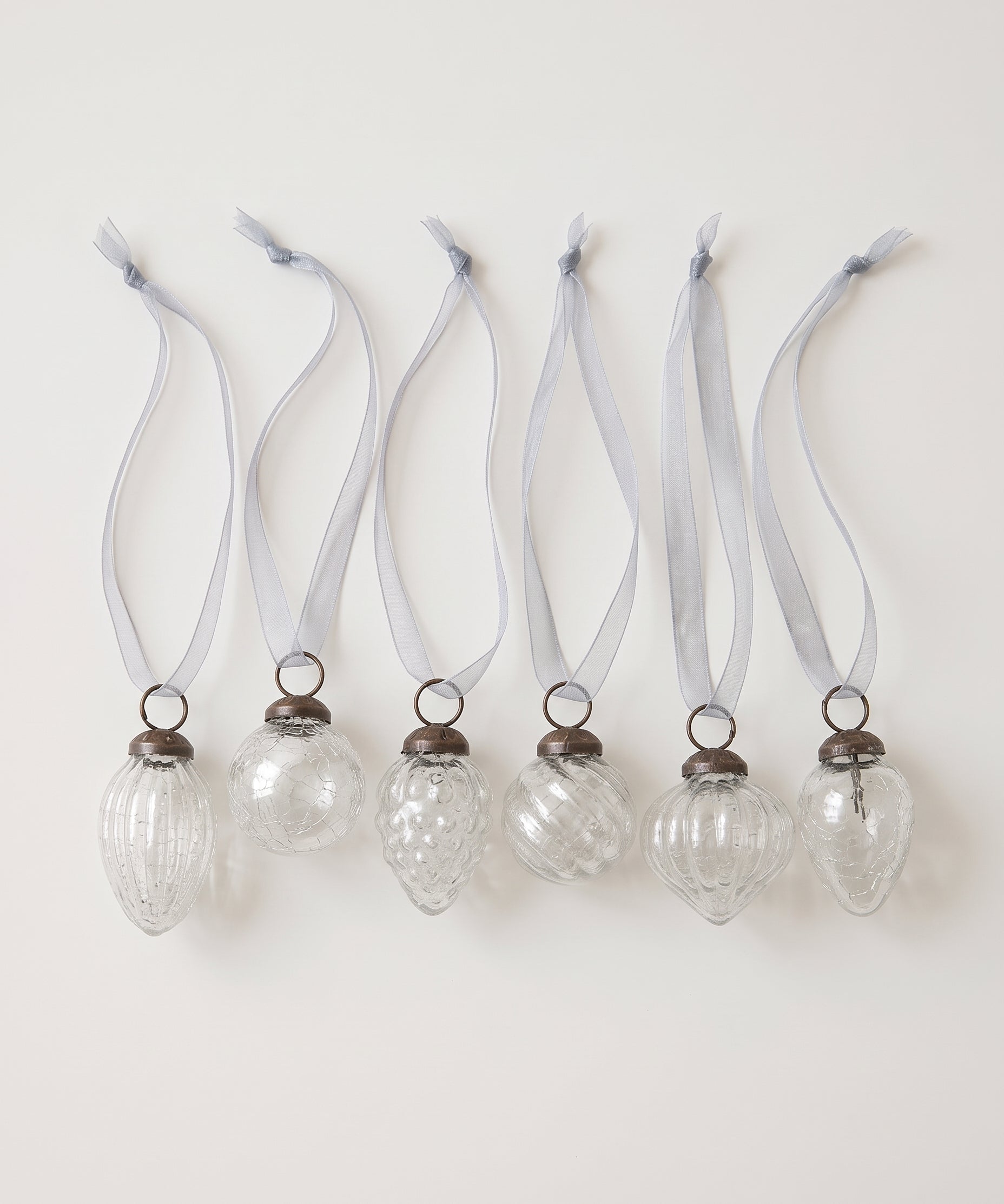 Set of six clear crackle glass Christmas baubles with bronze caps and ribbon hangers, made in India