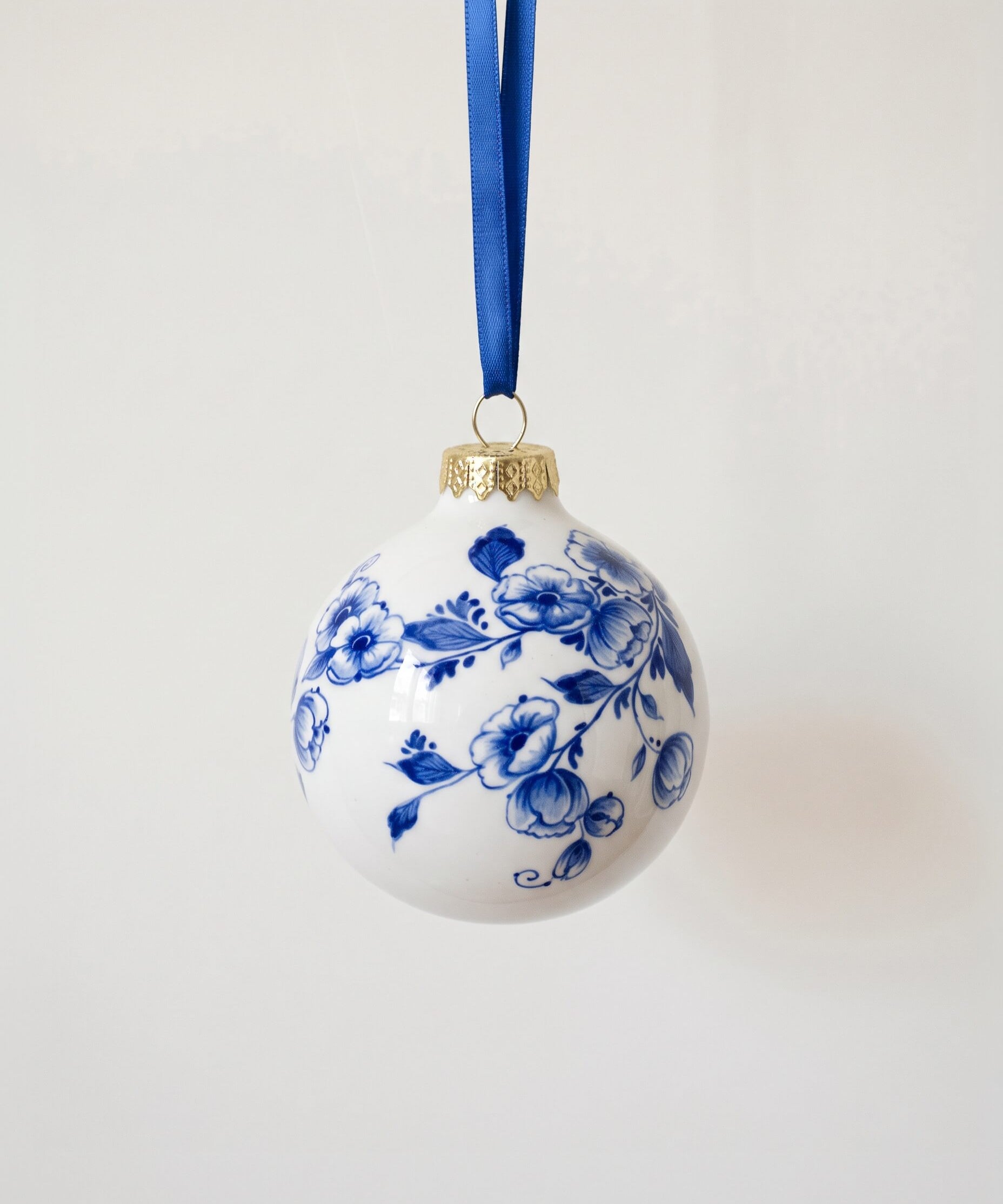 Blue and white Delft porcelain Christmas ball hand-painted with traditional florals, made in Delft, Netherlands