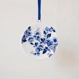 Miniature Delft porcelain plate ornament with a hand-painted blue floral centre, made in Delft, Netherlands