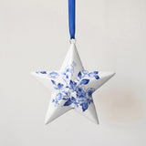 Porcelain star ornament hand-painted with a Delft blue floral motif, made in Delft, Netherlands
