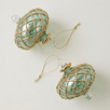 Hand-blown emerald green glass saucer ornament with a gold diamond harlequin pattern, made in Old Cairo, Egypt
