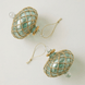 Hand-blown emerald green glass saucer ornament with a gold diamond harlequin pattern, made in Old Cairo, Egypt