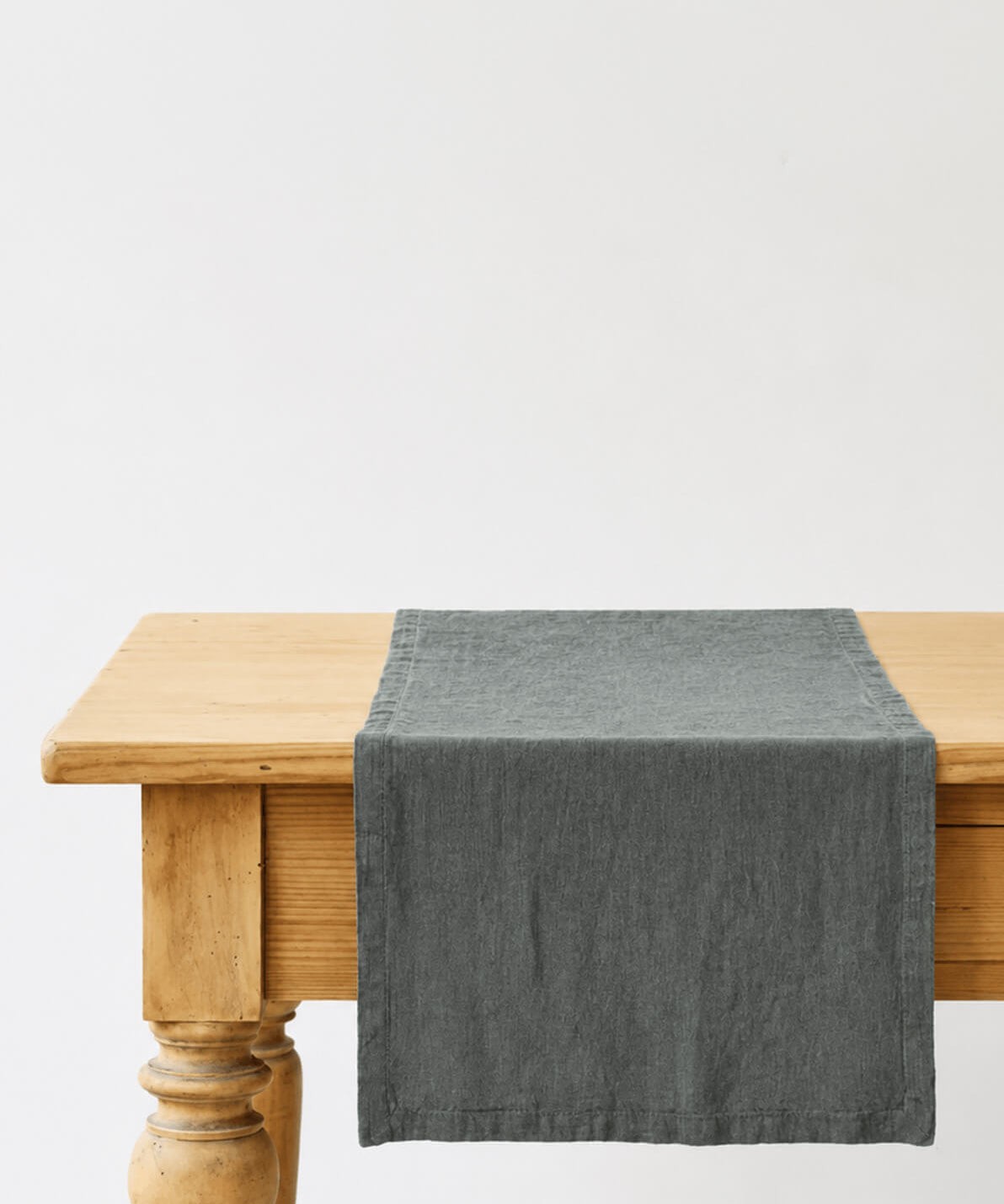 Forest green stone-washed linen table runner, woven in Lithuania from European flax