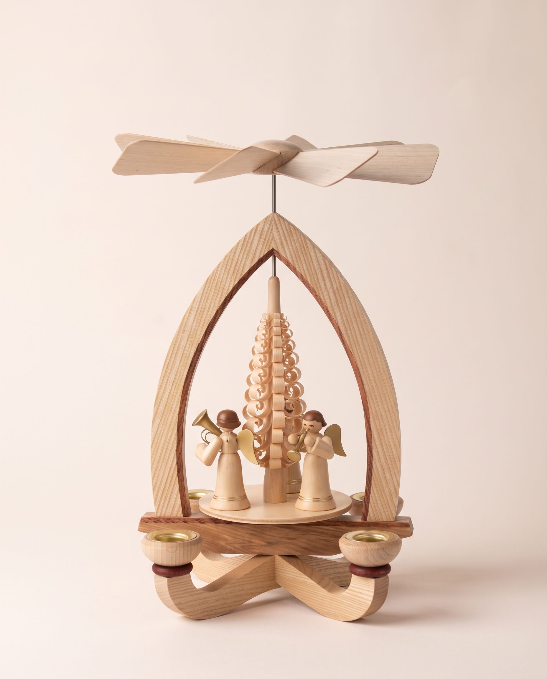 Hand-carved lime wood candle pyramid with trumpeting angels and gold detail, another view