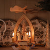 Hand-carved lime wood candle pyramid with trumpeting angels and gold detail, made in Seiffen, Germany