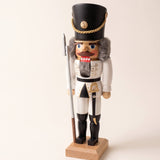 White and gold hand-painted wooden nutcracker soldier, made in Seiffen, Germany
