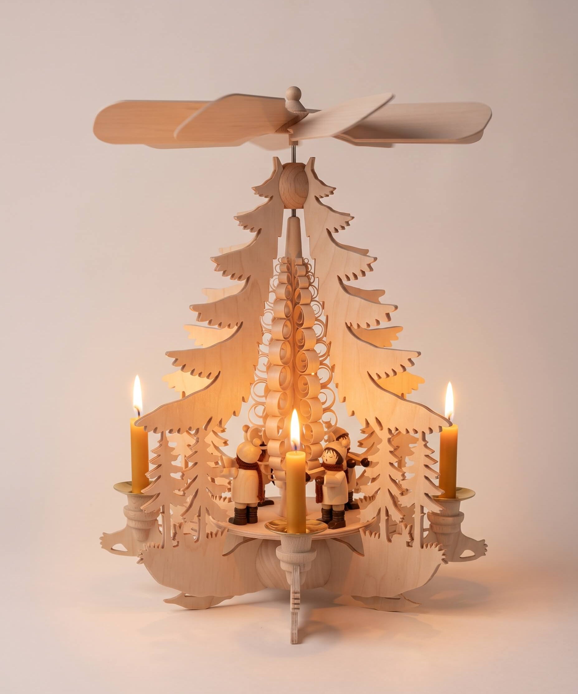 Hand-painted wooden candle pyramid with carol singers around a wood chip curl tree, made in Seiffen, Germany