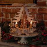 Hand-carved lime wood candle pyramid with deer and evergreens in a forest scene, made in Seiffen, Germany