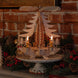 Hand-carved lime wood candle pyramid with deer and evergreens in a forest scene, made in Seiffen, Germany