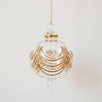 Hand-blown clear glass bauble painted with delicate gold drapes, made in Old Cairo, Egypt