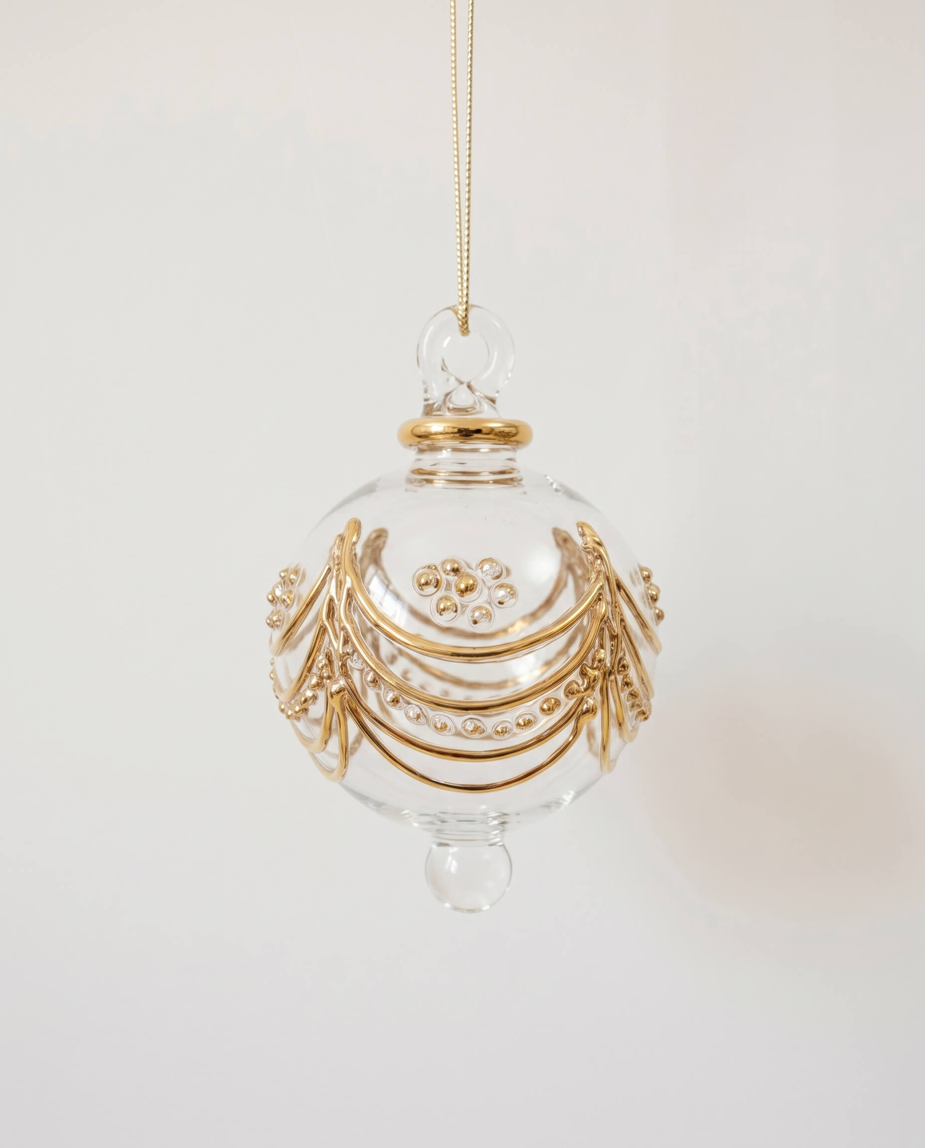 Hand-blown clear glass bauble painted with delicate gold drapes, made in Old Cairo, Egypt