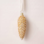 Gold mouth-blown glass pinecone ornament dusted with white glitter, by Inge-Glas of Lauscha, Germany