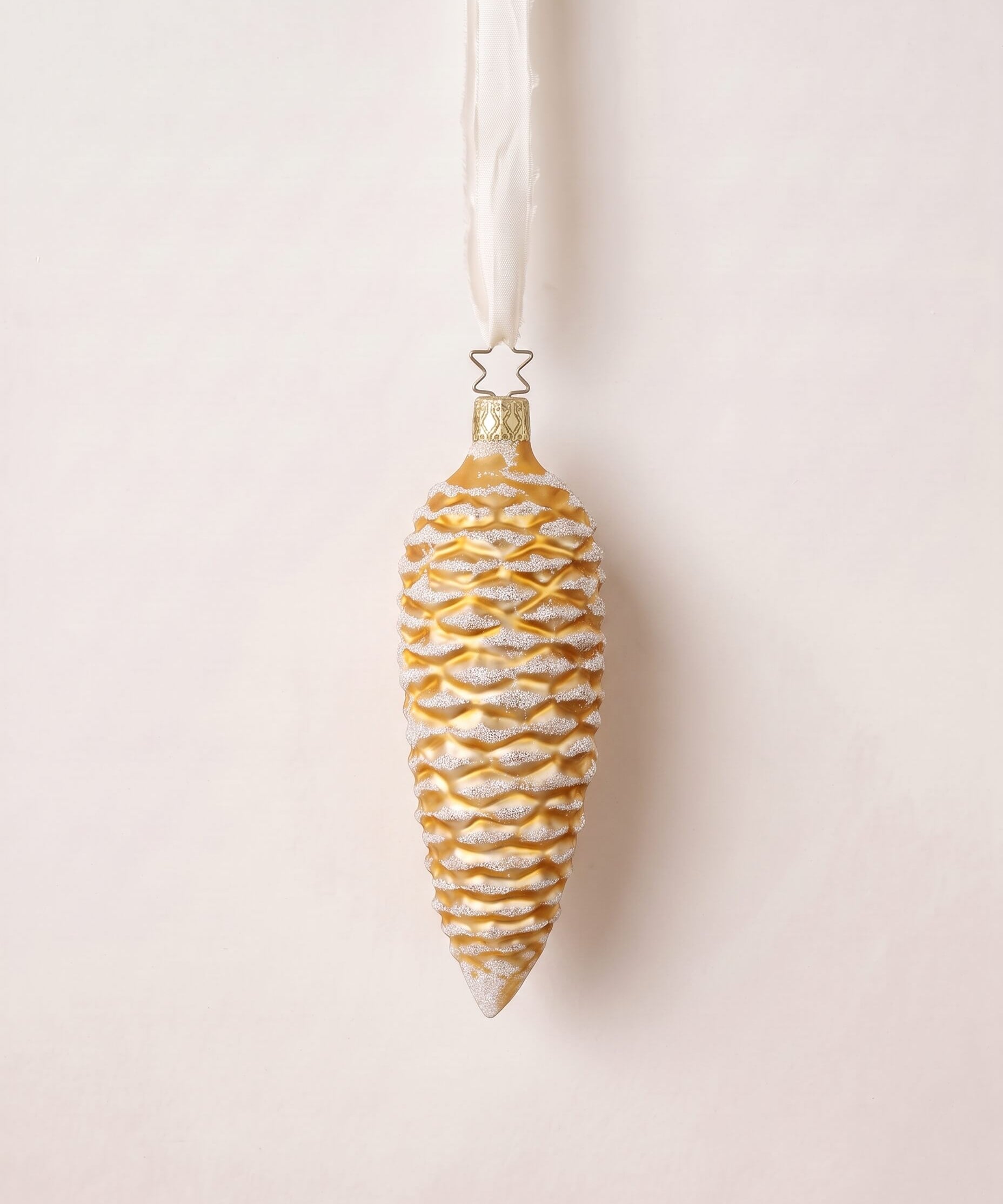 Gold mouth-blown glass pinecone ornament dusted with white glitter, by Inge-Glas of Lauscha, Germany