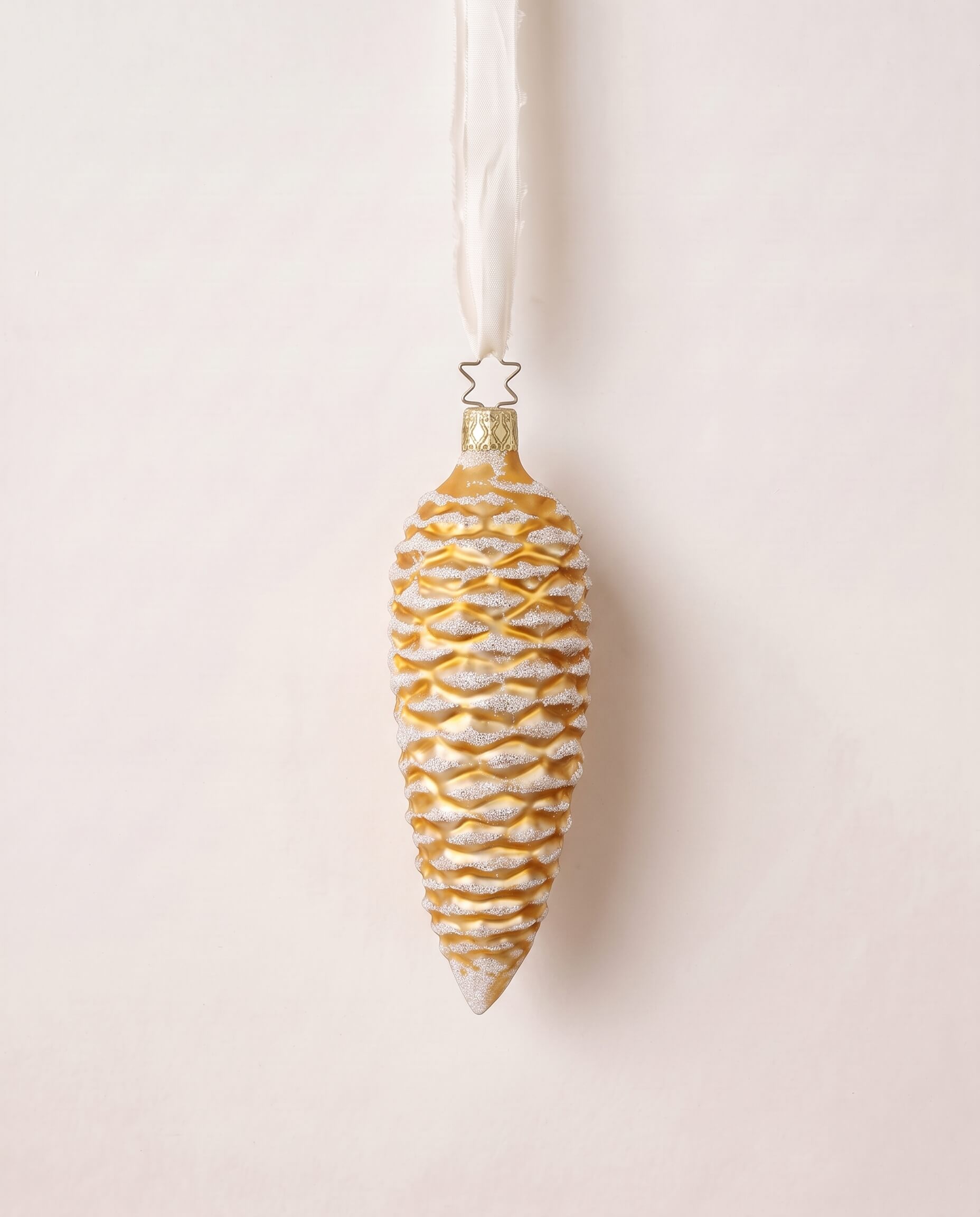 Gold mouth-blown glass pinecone ornament dusted with white glitter, by Inge-Glas of Lauscha, Germany