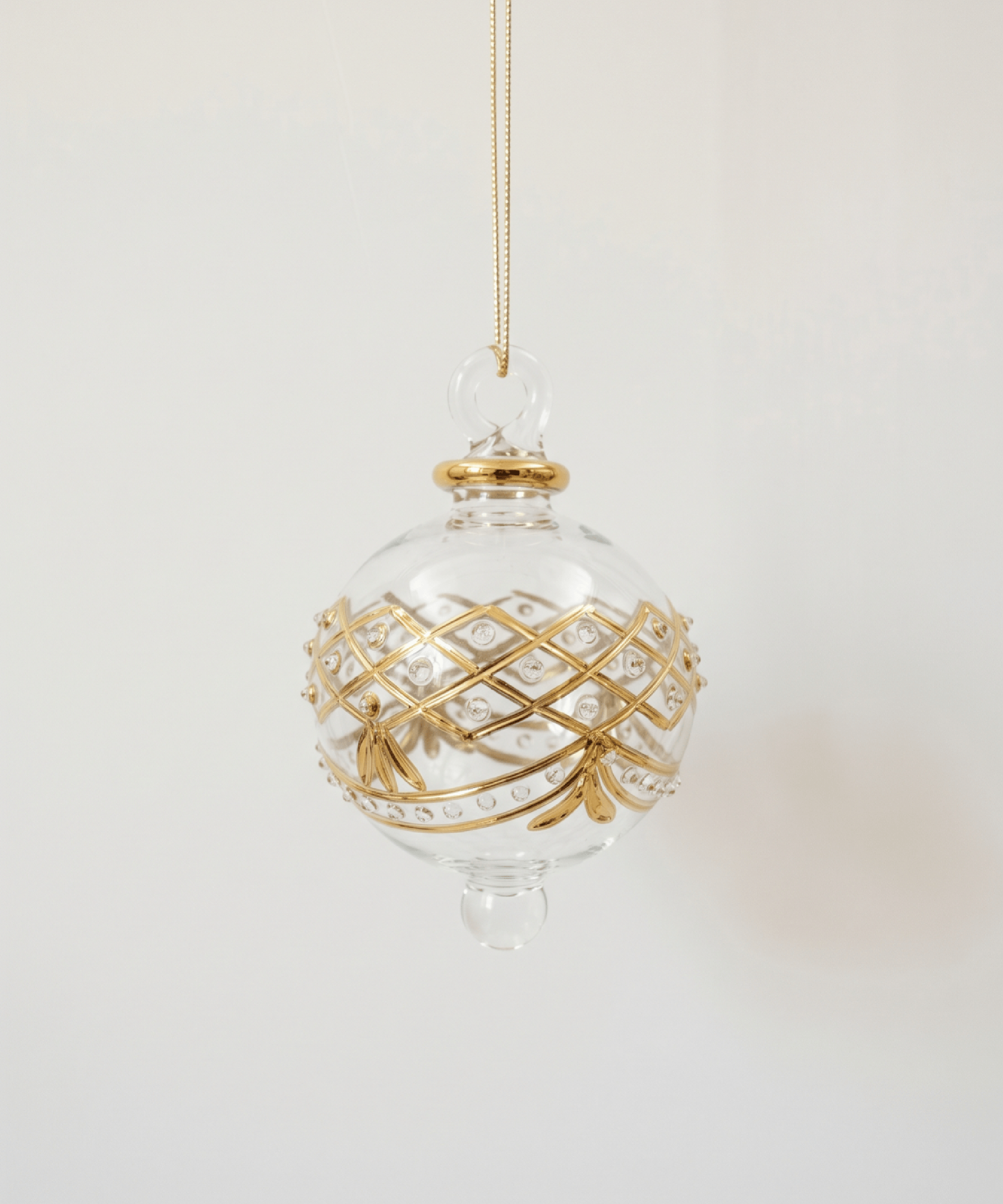 Hand-blown clear glass bauble painted with gold garland swags, made in Old Cairo, Egypt
