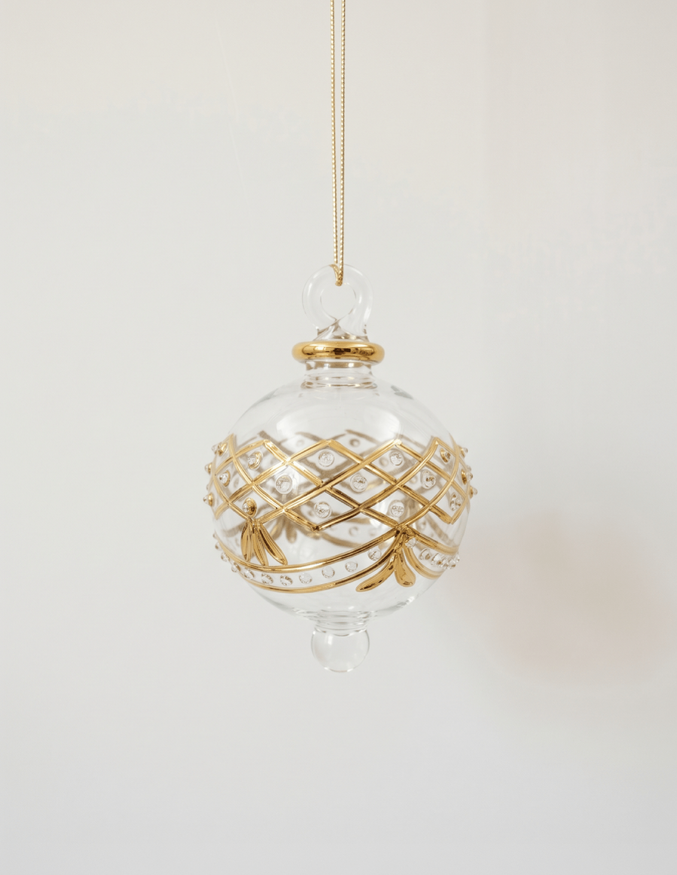 Hand-blown clear glass bauble painted with gold garland swags, made in Old Cairo, Egypt