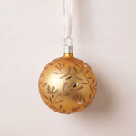Matte gold mouth-blown glass ball ornament with hand-glittered swirls, by Inge-Glas of Lauscha, Germany