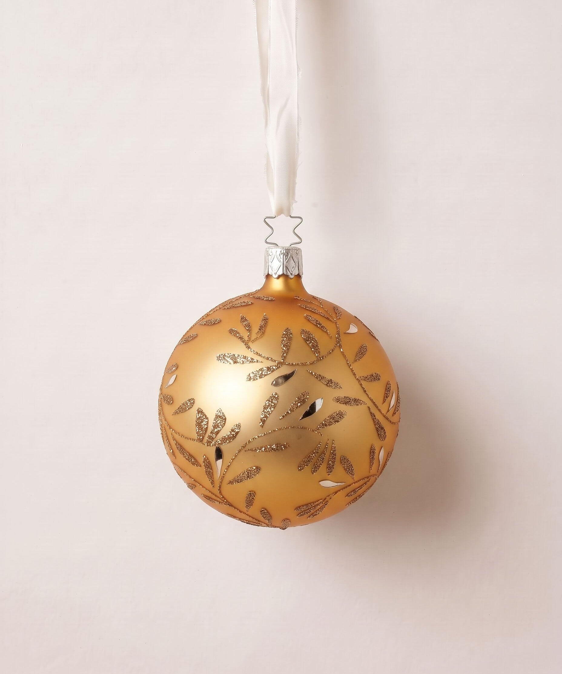 Matte gold mouth-blown glass ball ornament with hand-glittered swirls, by Inge-Glas of Lauscha, Germany