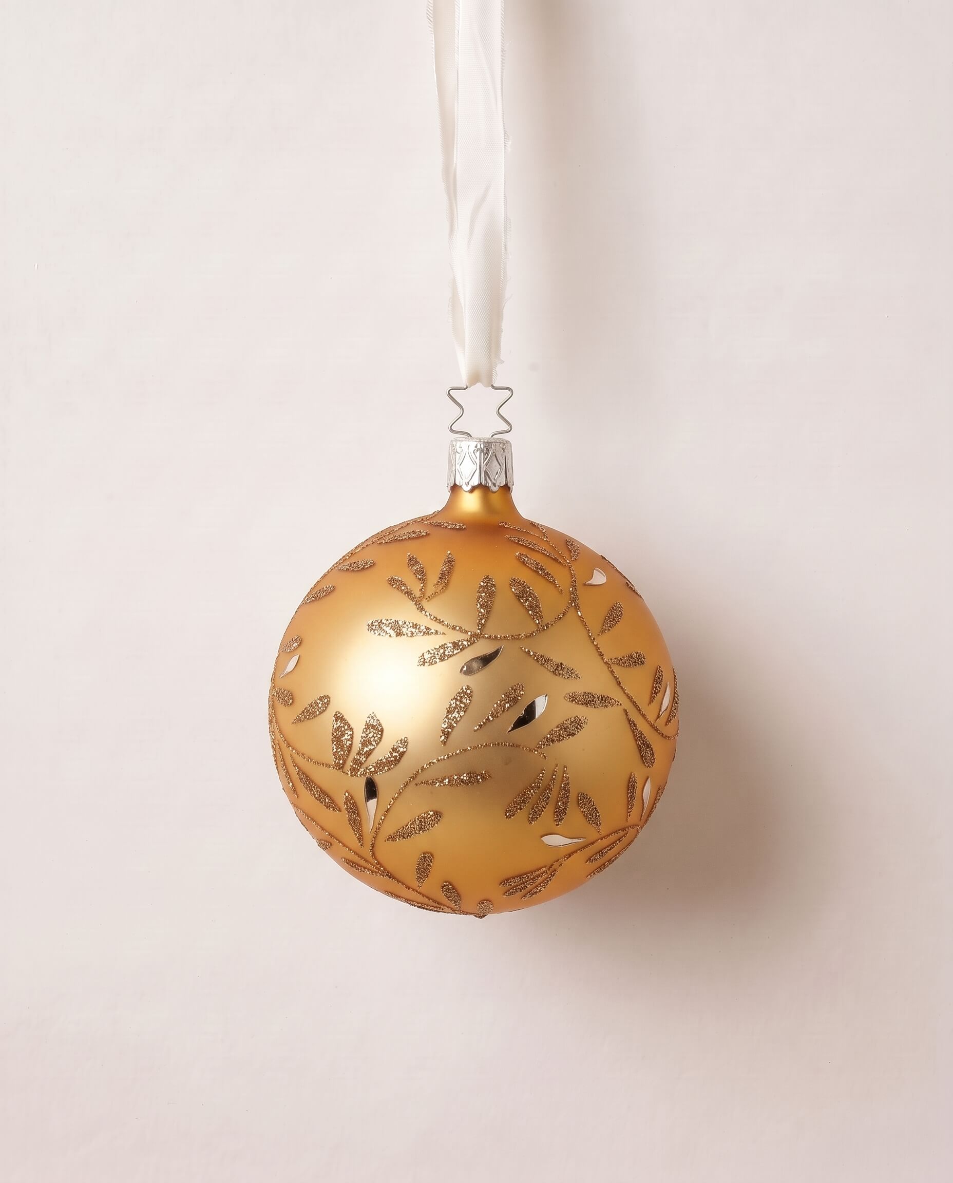 Matte gold mouth-blown glass ball ornament with hand-glittered swirls, by Inge-Glas of Lauscha, Germany