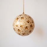 Ivory papier-mache ornament hand-painted with golden vines in Kashmir