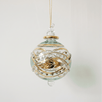 Hand-blown green glass bauble painted with gold garland swags, made in Old Cairo, Egypt