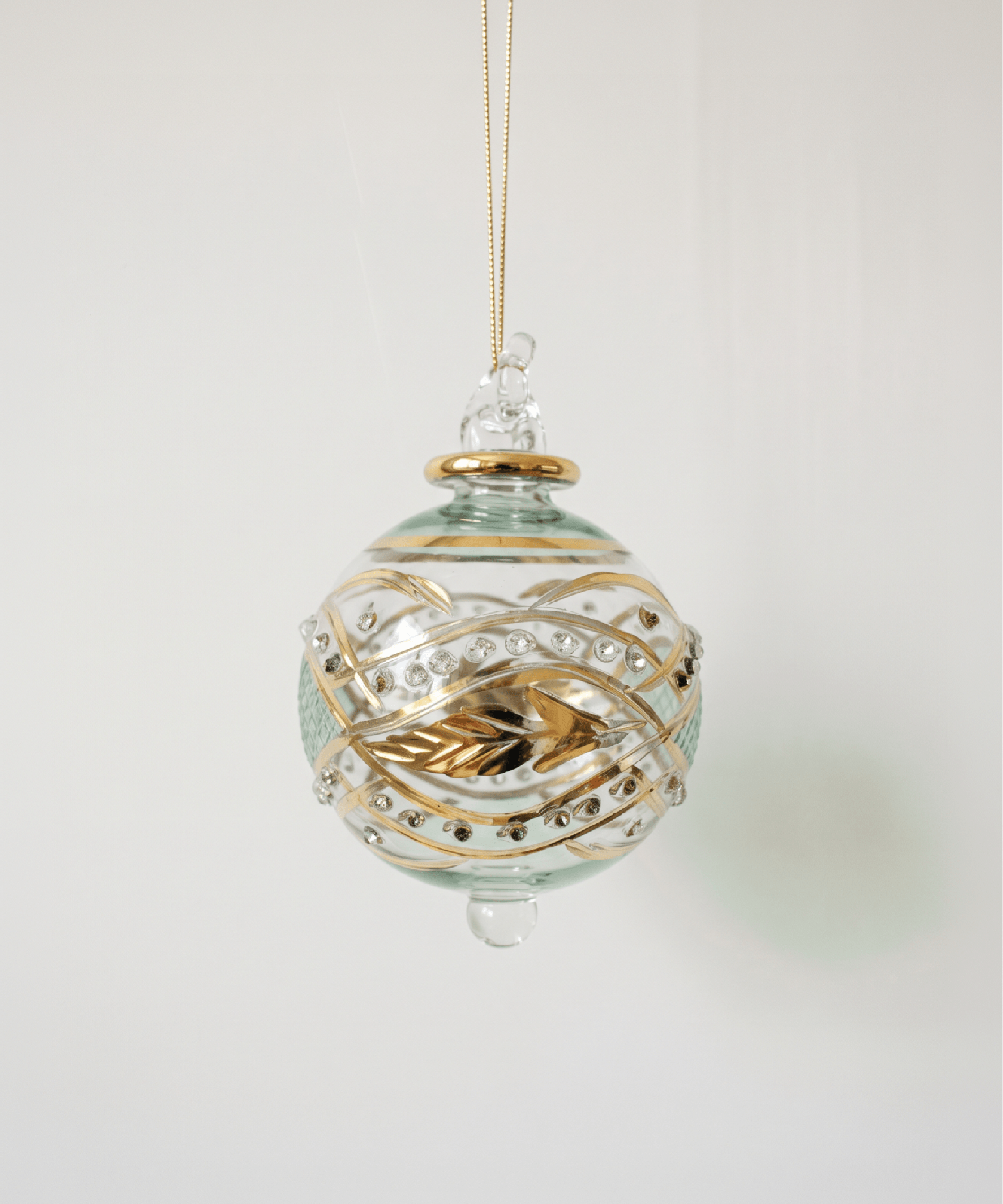 Hand-blown green glass bauble painted with gold garland swags, made in Old Cairo, Egypt