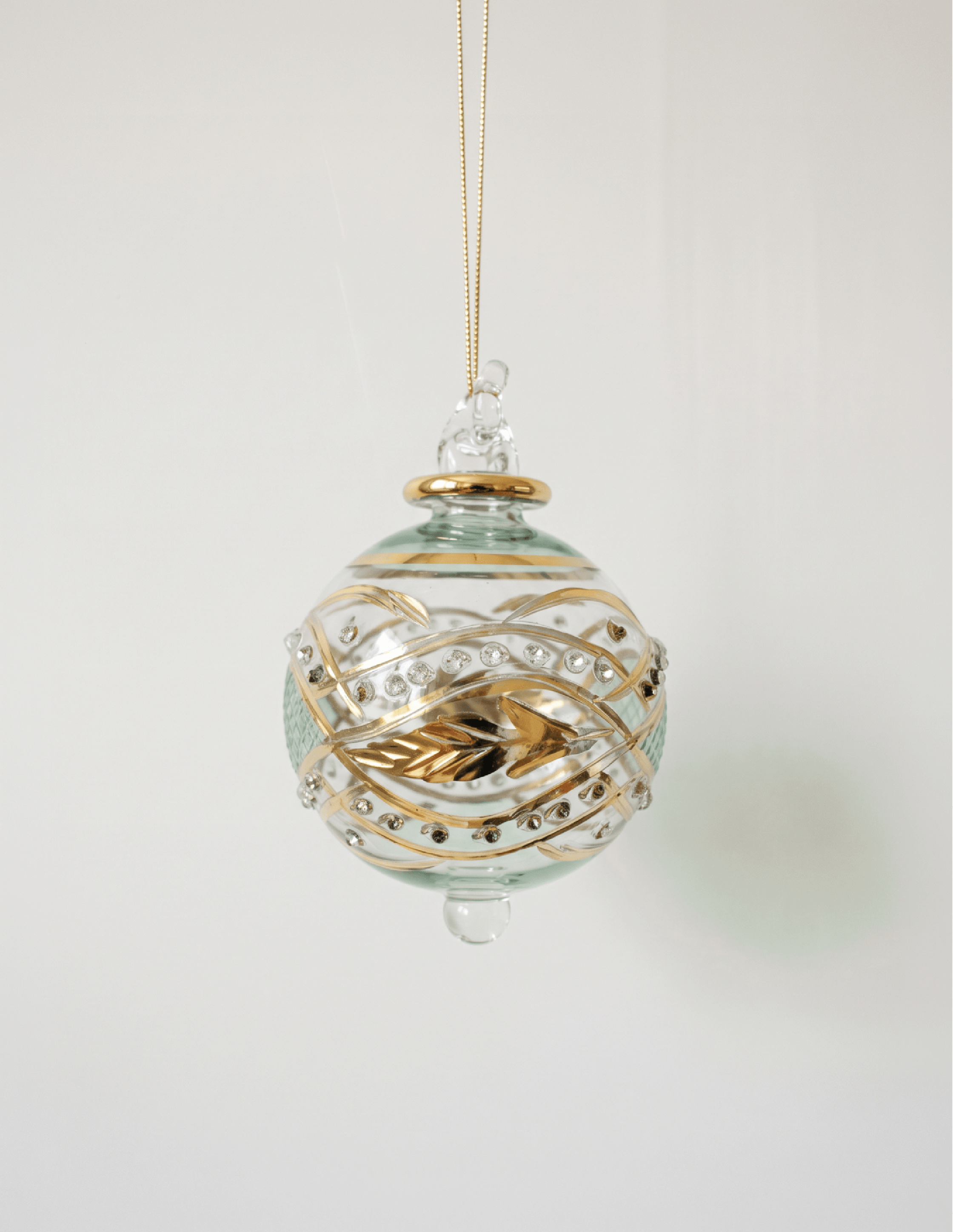 Hand-blown green glass bauble painted with gold garland swags, made in Old Cairo, Egypt